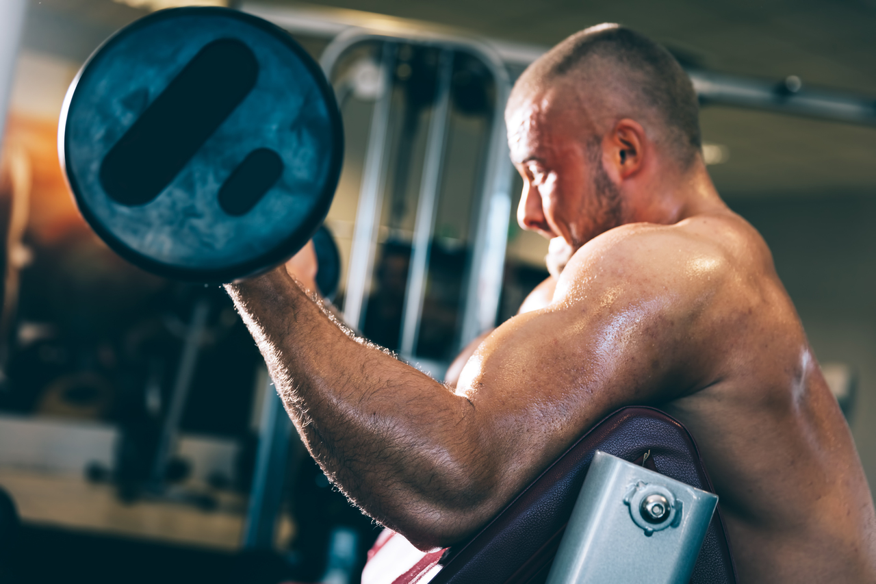A man who takes Ibutamoren MK-677 lifting heavy weights