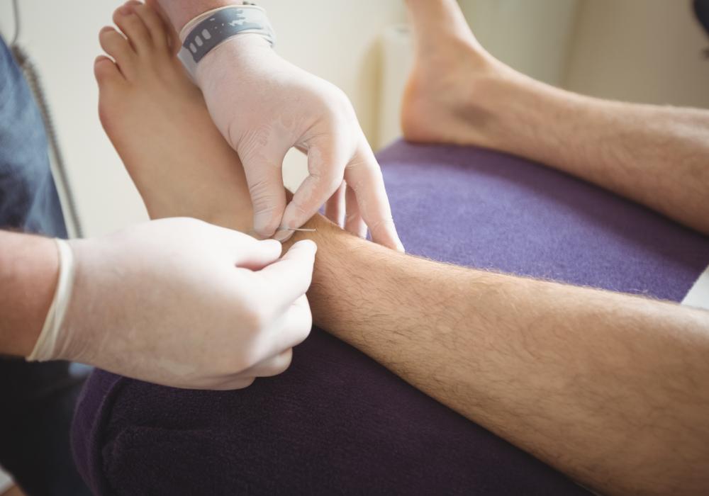 A doctor checking to see if a wound is healing or infected.