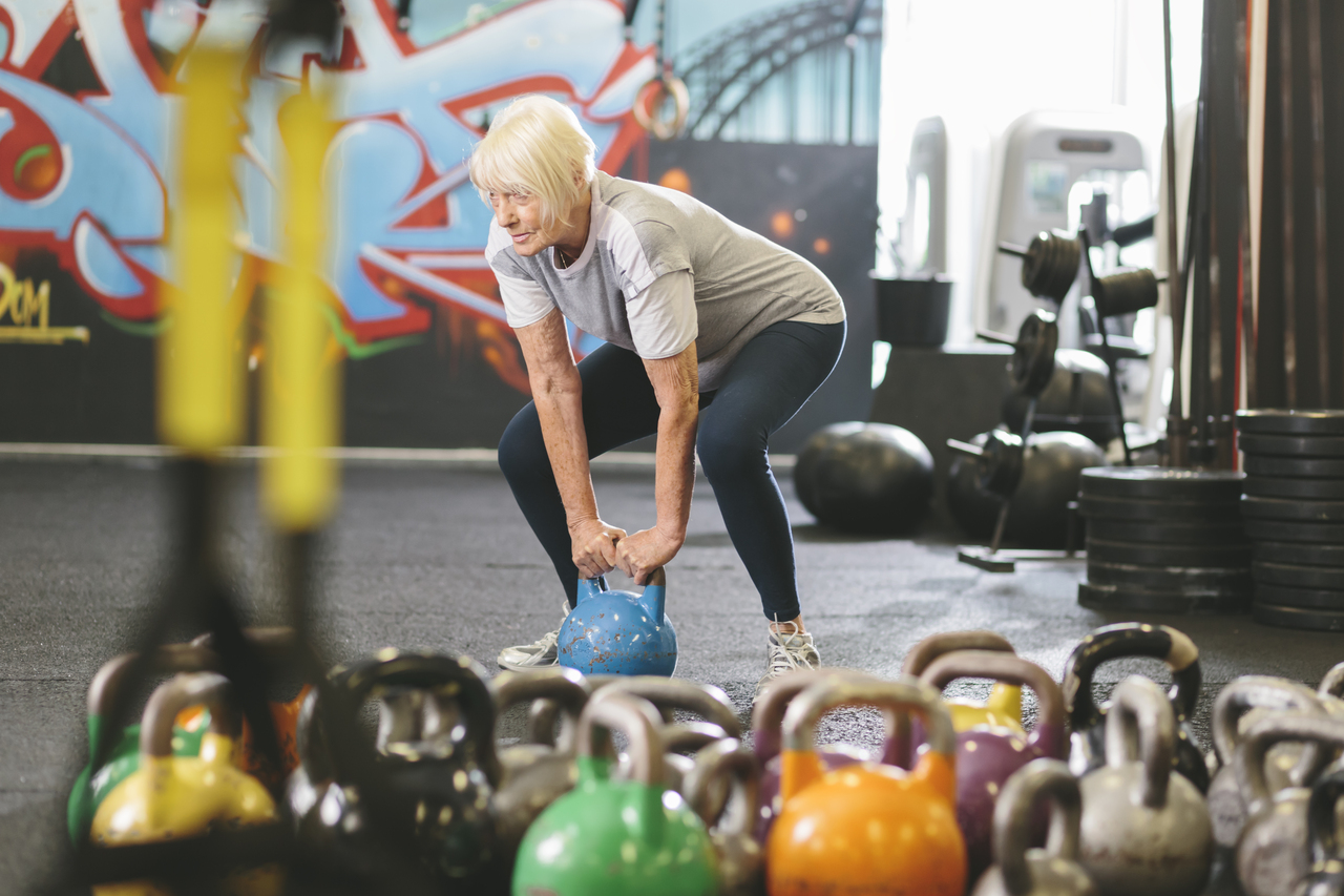A senior woman who takes gonadorelin lifting weights