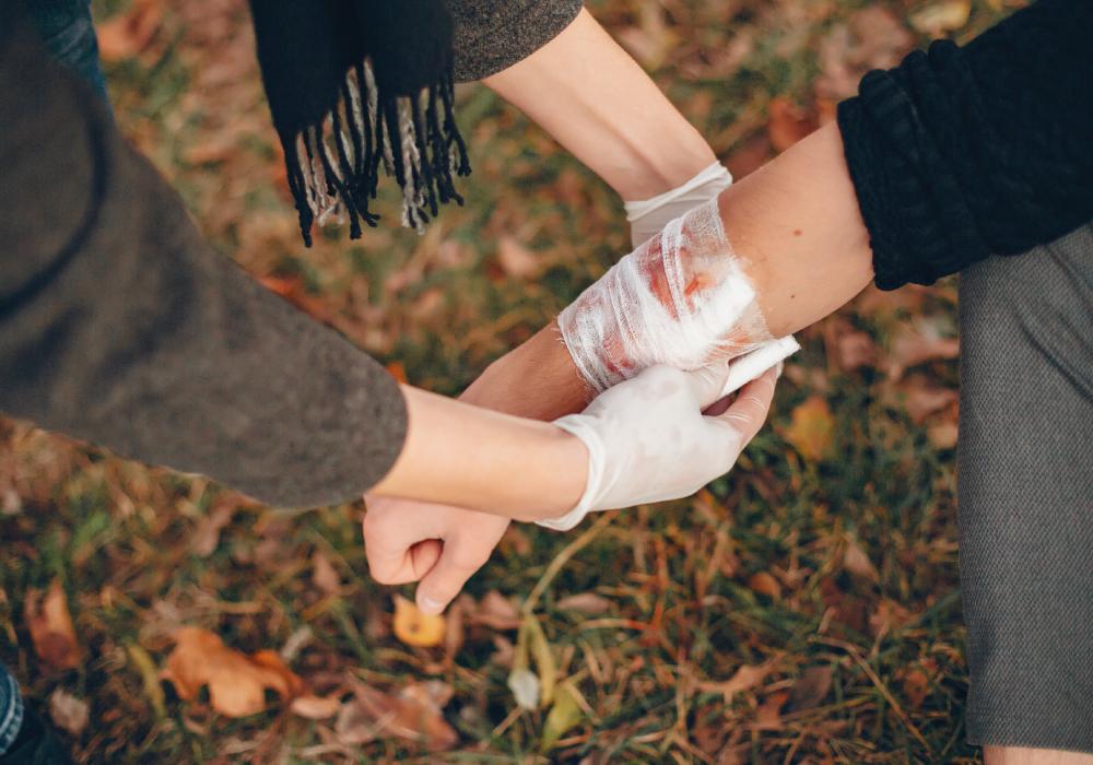 A doctor checking to see if a wound is healing or infected.