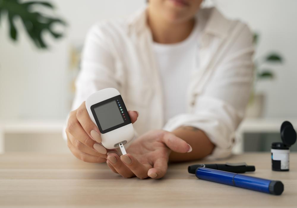 A diabetic testing her blood sugar with a small device.